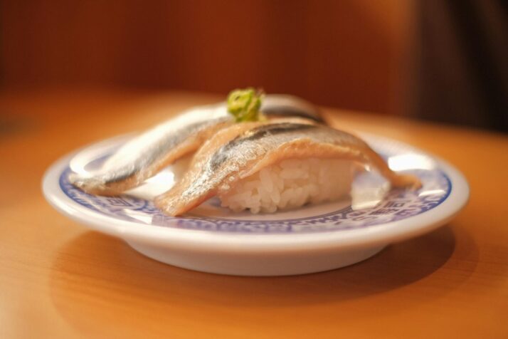 raw fish with sushi rice on a plate