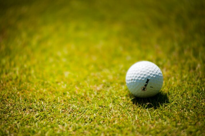 white golf ball on green grass